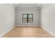 Bright bedroom with hardwood floors and a large window at 179 Heartland Dr # 8, Rock Hill, SC 29732