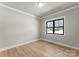 Spacious bedroom with hardwood floors and large window at 179 Heartland Dr # 8, Rock Hill, SC 29732
