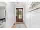 Bright entryway featuring a wood door with glass panels, wainscoting, and wood flooring at 179 Heartland Dr # 8, Rock Hill, SC 29732