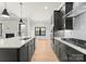 Eat-in kitchen with dark cabinetry, gas cooktop and double ovens at 179 Heartland Dr # 8, Rock Hill, SC 29732