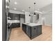 Open kitchen featuring a large island with sink and dishwasher at 179 Heartland Dr # 8, Rock Hill, SC 29732