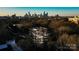 Aerial view of a building under construction, showcasing the city skyline in the background at 409 Queens Rd # 301, Charlotte, NC 28207