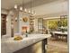 Modern kitchen with island, marble countertops, wine storage, and fireplace at 409 Queens Rd # 301, Charlotte, NC 28207