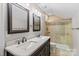 Bathroom with double sinks, a shower, and updated fixtures at 286 Glencoe Ln, Mooresville, NC 28117