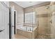 Bathroom with soaking tub, walk in shower, and double vanity at 286 Glencoe Ln, Mooresville, NC 28117