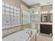 Spa-like bathroom with soaking tub, walk-in shower, and double vanity at 286 Glencoe Ln, Mooresville, NC 28117
