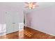 Bedroom with hardwood floors, double doors, and closet at 286 Glencoe Ln, Mooresville, NC 28117