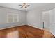 Hardwood floor bedroom with access to a bathroom at 286 Glencoe Ln, Mooresville, NC 28117