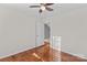 Bedroom with hardwood floors and access to another room at 286 Glencoe Ln, Mooresville, NC 28117