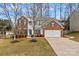 Two-story brick home with attached garage and landscaping at 286 Glencoe Ln, Mooresville, NC 28117