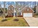 Two-story brick home with attached garage and landscaping at 286 Glencoe Ln, Mooresville, NC 28117