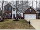 Two-story brick home with attached garage and landscaping at 286 Glencoe Ln, Mooresville, NC 28117