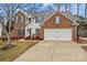 Two-story brick home with attached garage and landscaping at 286 Glencoe Ln, Mooresville, NC 28117
