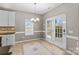 Eat-in kitchen with island, stainless steel appliances, and white cabinets at 286 Glencoe Ln, Mooresville, NC 28117