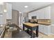 Eat-in kitchen with island, stainless steel appliances, and white cabinets at 286 Glencoe Ln, Mooresville, NC 28117
