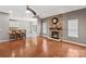 Spacious living room features hardwood floors, a stone fireplace, and an open kitchen at 286 Glencoe Ln, Mooresville, NC 28117