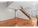 Living area with hardwood floors, a fireplace, and a staircase at 286 Glencoe Ln, Mooresville, NC 28117