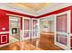 Bright home office with red walls and French doors at 286 Glencoe Ln, Mooresville, NC 28117