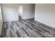A bright bedroom features durable flooring and a walk-in closet for ample storage space at 169 Salem Springs Ln, Statesville, NC 28625