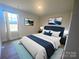 Beautiful bedroom with blue accents, featuring a plush bed and elegant decor at 169 Salem Springs Ln, Statesville, NC 28625