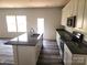 Modern kitchen featuring a kitchen island, stainless steel appliances, and elegant countertops at 169 Salem Springs Ln, Statesville, NC 28625
