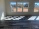 Sun-drenched living room featuring sleek flooring and large windows at 169 Salem Springs Ln, Statesville, NC 28625