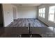Well-lit living room featuring sleek flooring and large windows at 169 Salem Springs Ln, Statesville, NC 28625