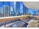 Spacious balcony with city views, seating area, and fire pit at 435 S Tryon St # 800, Charlotte, NC 28202