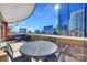 Balcony with table and chairs, offering stunning city views at 435 S Tryon St # 800, Charlotte, NC 28202