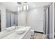 Modern bathroom with a floating double vanity and a shower/tub combo at 435 S Tryon St # 800, Charlotte, NC 28202