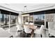 Bright dining room with city views and rustic wooden table at 435 S Tryon St # 800, Charlotte, NC 28202