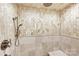 Large shower with unique stone tile and built in seat at 435 S Tryon St # 800, Charlotte, NC 28202