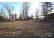 Spacious backyard with mature trees and open space at 4223 Old Catawba Rd, Claremont, NC 28610