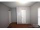 Small bedroom with two closets and brown carpet at 4223 Old Catawba Rd, Claremont, NC 28610