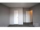 Simple bedroom with closet and access to hall at 4223 Old Catawba Rd, Claremont, NC 28610