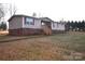 Front view of a ranch home with a brick base and deck at 4223 Old Catawba Rd, Claremont, NC 28610