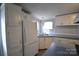 Galley kitchen, white cabinets, and blue countertops at 4223 Old Catawba Rd, Claremont, NC 28610