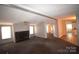 Living room featuring a fireplace and an open floor plan at 4223 Old Catawba Rd, Claremont, NC 28610