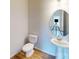 This bathroom showcases a pedestal sink and an oval mirror for a contemporary design at 4223 S New Hope Rd # 8, Cramerton, NC 28032