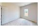 Cozy bedroom with bright natural light and neutral carpet at 4223 S New Hope Rd # 8, Cramerton, NC 28032