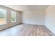 Comfortable bedroom featuring large windows that fill the room with natural light and beautiful hardwood floors at 4223 S New Hope Rd # 8, Cramerton, NC 28032