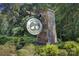 The Villages at Cramerton Mills community sign surrounded by lush greenery at 4223 S New Hope Rd # 8, Cramerton, NC 28032