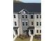 Aerial view of a modern townhome showcasing its architectural details and surrounding landscape, including manicured front lawns at 4223 S New Hope Rd # 8, Cramerton, NC 28032