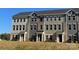 Modern townhomes are designed with diverse exteriors and accented with freshly landscaped yards at 4223 S New Hope Rd # 8, Cramerton, NC 28032