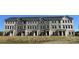 New townhomes boast varied neutral exteriors with ample windows and groomed lawns at 4223 S New Hope Rd # 8, Cramerton, NC 28032