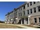 These townhomes feature a mix of siding and brick, complemented by well-manicured lawns and tasteful landscaping at 4223 S New Hope Rd # 8, Cramerton, NC 28032