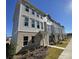 Stylish townhomes feature neutral siding, large windows, and landscaped yards for a modern aesthetic at 4223 S New Hope Rd # 8, Cramerton, NC 28032
