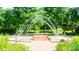 Beautiful water fountain feature with brick walkways and lush green surroundings at 4223 S New Hope Rd # 8, Cramerton, NC 28032