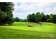 Scenic golf course view with lush green fairways and mature trees on a sunny day at 4223 S New Hope Rd # 8, Cramerton, NC 28032