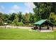 Picturesque park featuring a covered pavilion, walking bridge, and lush green lawn at 4223 S New Hope Rd # 8, Cramerton, NC 28032